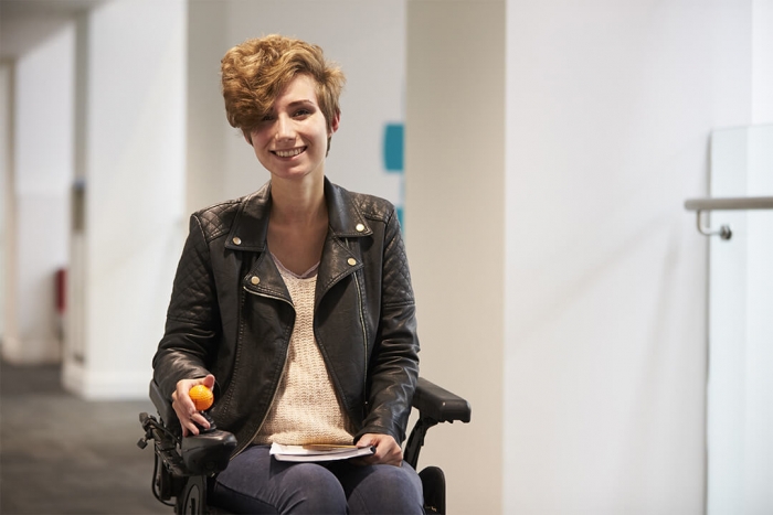 Older girl in wheelchair smiling